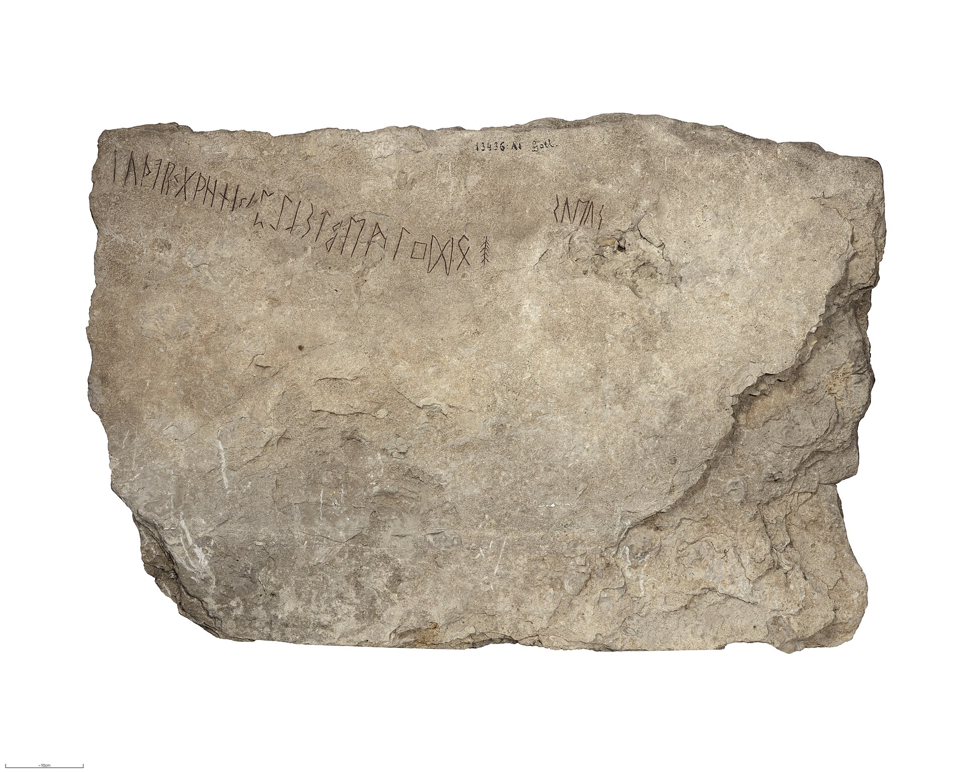 The Kylver stone, a grey limestone slab carved with the complete 24-rune Elder Futhark row, in the Swedish History Museum